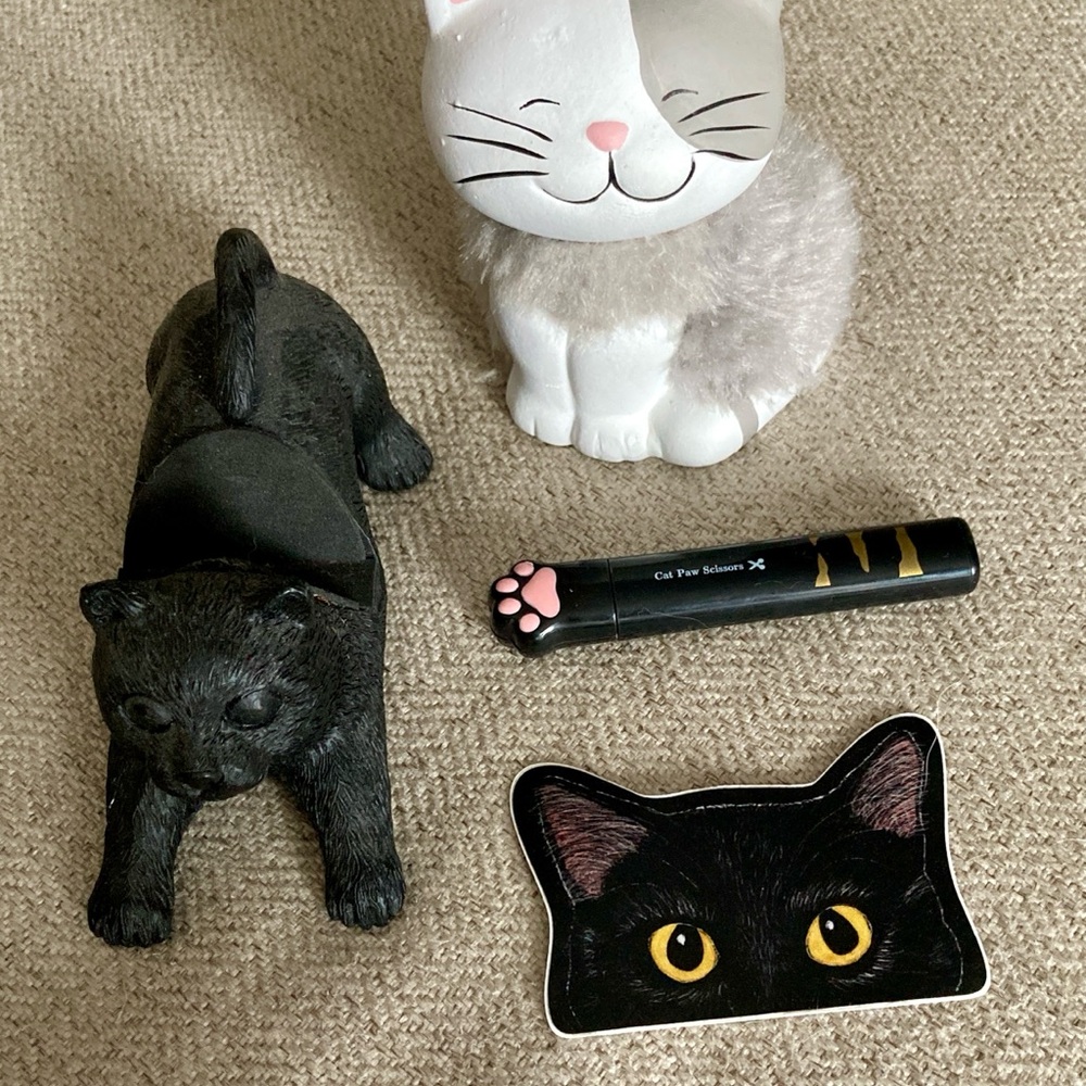 Figurine, smart phone holder, sticker and mini portable scissors